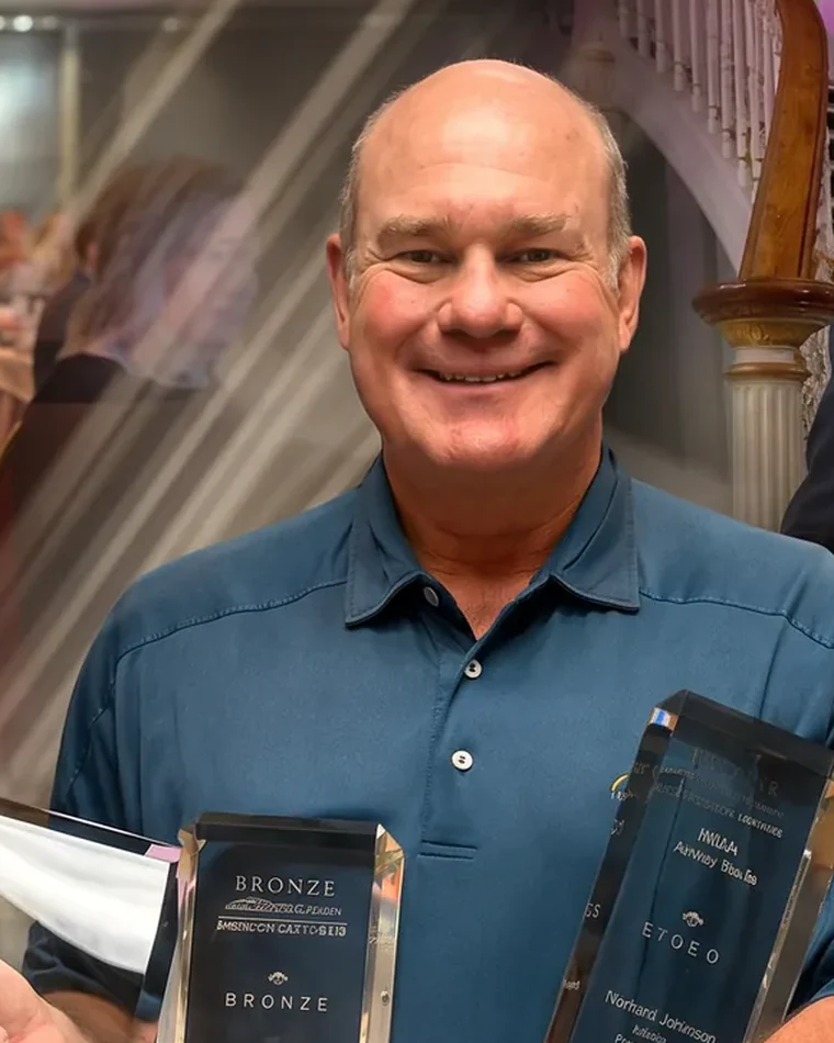 Richard Johnson with his industry awards